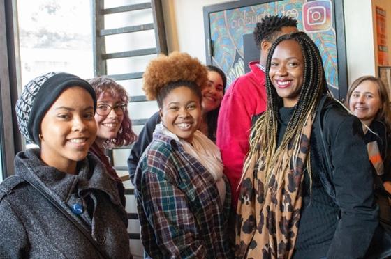 Photo of a group of female Chatham University students on an off-campus trip to a restaurant